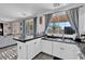 Open kitchen layout featuring dark countertops and backyard view at 3186 Lapis Beach Dr, Las Vegas, NV 89117
