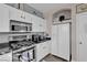 Bright kitchen with white cabinets, stainless appliances, and modern finishes at 3186 Lapis Beach Dr, Las Vegas, NV 89117