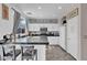 Bright kitchen with white cabinetry, modern appliances, and countertop seating at 3186 Lapis Beach Dr, Las Vegas, NV 89117