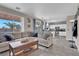 Spacious living room featuring tile floors and access to the outdoor living area at 3186 Lapis Beach Dr, Las Vegas, NV 89117