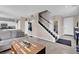 Spacious living room with view into the kitchen and stairway at 3186 Lapis Beach Dr, Las Vegas, NV 89117