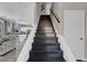 Staircase to second story leads to a living area, creating an inviting transition between floors at 3186 Lapis Beach Dr, Las Vegas, NV 89117