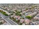 This high-level aerial shot presents a neighborhood view with many homes, each with desert landscaping at 3217 Palladio Ave, North Las Vegas, NV 89031