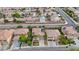 Aerial shot of residential neighborhood with solar panels, lush lawns, and desert landscaping at 3217 Palladio Ave, North Las Vegas, NV 89031