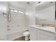 Clean bathroom featuring a shower/tub combo, toilet, and vanity with ample storage and natural light at 3217 Palladio Ave, North Las Vegas, NV 89031