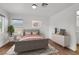 Bright bedroom with a comfortable bed, soft bedding, and a dresser with stylish decor at 3217 Palladio Ave, North Las Vegas, NV 89031