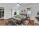 Inviting bedroom with a well-made bed, patterned rug, closet, and ample natural light at 3217 Palladio Ave, North Las Vegas, NV 89031