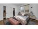 Cozy bedroom with plush bedding, a patterned rug, closet with organized storage, and natural light at 3217 Palladio Ave, North Las Vegas, NV 89031