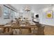 Formal dining area with large windows, modern furniture, and decor offers great space for entertaining at 3217 Palladio Ave, North Las Vegas, NV 89031