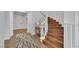 Welcoming entryway boasts a curved staircase and stylish decor at 3217 Palladio Ave, North Las Vegas, NV 89031
