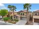 Charming two-story stucco home with a stone accent, tile roof, a two-car garage, and desert landscaping at 3217 Palladio Ave, North Las Vegas, NV 89031