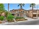 Attractive two-story home showcasing stone accents, desert landscaping, and a multi-car garage at 3217 Palladio Ave, North Las Vegas, NV 89031