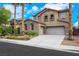 Inviting front exterior showcasing a well-maintained lawn, a tile roof, and a convenient three-car garage at 3217 Palladio Ave, North Las Vegas, NV 89031