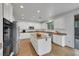 Bright kitchen features white cabinetry, a large island, granite countertops and stainless appliances at 3217 Palladio Ave, North Las Vegas, NV 89031