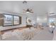 Bright living room features hardwood floors, ceiling fan, and large windows with shutters at 3217 Palladio Ave, North Las Vegas, NV 89031