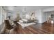 Relaxing main bedroom features a chandelier, neutral decor, and rich hardwood floors at 3217 Palladio Ave, North Las Vegas, NV 89031