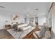 Bright main bedroom with hardwood floors, chandelier, and sitting area at 3217 Palladio Ave, North Las Vegas, NV 89031