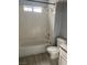 Clean bathroom featuring a shower-tub combo with white tiling and a modern toilet at 3450 Erva St # 167, Las Vegas, NV 89117