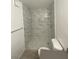 Bathroom featuring tile shower, shower niche, wood-look floors and vanity with sink at 3450 Erva St # 167, Las Vegas, NV 89117