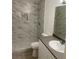 Bathroom featuring tile shower, shower niche, wood-look floors and vanity with sink at 3450 Erva St # 167, Las Vegas, NV 89117