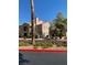 Two-story condo with desert landscaping, a private balcony, and a distinctive chimney under a clear sky at 3450 Erva St # 167, Las Vegas, NV 89117