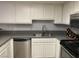 Kitchen with white cabinets, gray countertops, and stainless steel appliances providing a modern aesthetic at 3450 Erva St # 167, Las Vegas, NV 89117