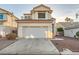 Well-maintained two-story home with a two-car garage, desert landscaping, and a clean, welcoming facade at 3525 Tuscany Village Dr, Las Vegas, NV 89129