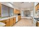 Spacious kitchen featuring light wood cabinets, tiled countertops, and tile floors at 3525 Tuscany Village Dr, Las Vegas, NV 89129
