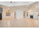 Bright living room featuring tile floors, a fireplace, and neutral walls at 3525 Tuscany Village Dr, Las Vegas, NV 89129