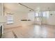Open living space with soaring ceilings, tile flooring, a fireplace, and large windows for ample natural light at 3525 Tuscany Village Dr, Las Vegas, NV 89129
