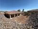 Spacious backyard featuring a covered patio, perfect for outdoor gatherings and relaxation at 3567 Cottage Stream Ct, Laughlin, NV 89029