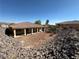 Expansive backyard with covered patio, perfect for outdoor entertaining and relaxing at 3567 Cottage Stream Ct, Laughlin, NV 89029