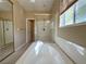 Bathroom showcasing a soaking tub with a glass shower and a window at 3567 Cottage Stream Ct, Laughlin, NV 89029