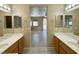 Well-lit bathroom boasting dual sinks and a view into the bedroom area at 3567 Cottage Stream Ct, Laughlin, NV 89029