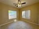 Bedroom featuring tiled floors and two windows providing natural light at 3567 Cottage Stream Ct, Laughlin, NV 89029