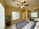 Comfortable bedroom with ample natural light, ceiling fan, and closet with mirrored doors at 3567 Cottage Stream Ct, Laughlin, NV 89029