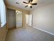 Bedroom featuring a closet, neutral walls, tile flooring, and a ceiling fan at 3567 Cottage Stream Ct, Laughlin, NV 89029