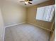 Bedroom featuring neutral walls, tile flooring, and a ceiling fan at 3567 Cottage Stream Ct, Laughlin, NV 89029