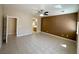 Spacious bedroom with neutral colors, ceiling fan, and tile flooring at 3567 Cottage Stream Ct, Laughlin, NV 89029