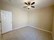 This bedroom features neutral walls, tile flooring and a ceiling fan at 3567 Cottage Stream Ct, Laughlin, NV 89029