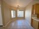 Cozy dining area with tile flooring and a pendant light fixture at 3567 Cottage Stream Ct, Laughlin, NV 89029
