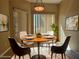 Dining area featuring stylish furnishings and decor, filled with natural light at 3567 Cottage Stream Ct, Laughlin, NV 89029