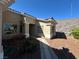 Exterior view highlighting desert landscaping near the house entrance at 3567 Cottage Stream Ct, Laughlin, NV 89029