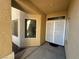 A welcoming covered entrance with a decorative front door and a window at 3567 Cottage Stream Ct, Laughlin, NV 89029