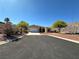 Charming single-story home featuring a desert landscape and a two-car garage at 3567 Cottage Stream Ct, Laughlin, NV 89029
