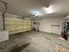 Spacious garage with ample storage space, and a large garage door for easy access at 3567 Cottage Stream Ct, Laughlin, NV 89029