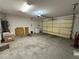 Spacious garage featuring water heater and plenty of room for storage at 3567 Cottage Stream Ct, Laughlin, NV 89029