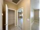 Hallway with tile flooring leading to a walk-in pantry and other rooms in the home at 3567 Cottage Stream Ct, Laughlin, NV 89029
