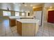 Kitchen featuring a kitchen island, white appliances, and an open layout at 3567 Cottage Stream Ct, Laughlin, NV 89029