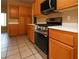 Modern kitchen with stainless steel appliances, light wood cabinets, and a built-in microwave at 3567 Cottage Stream Ct, Laughlin, NV 89029